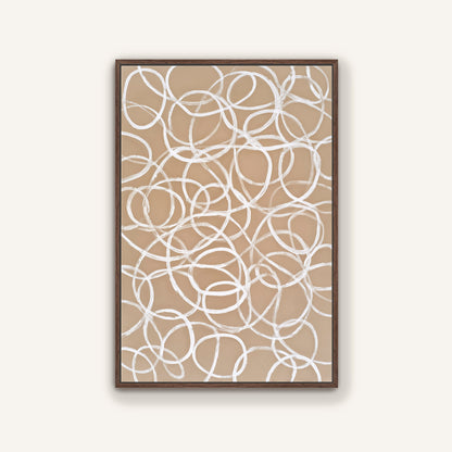 a framed abstract artwork with a repeating pattern of white circles on a beige background.