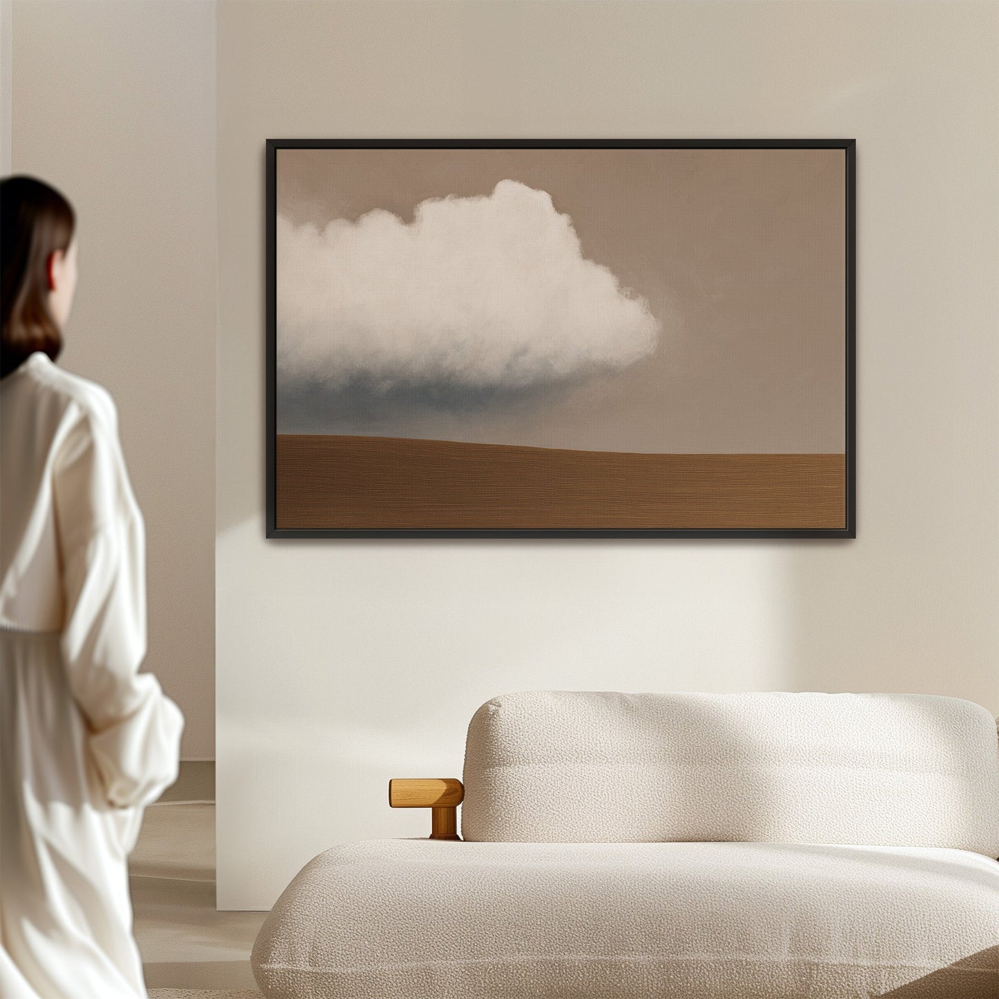 Aerie Canvas Print minimalist landscape with single cloud and muted earth tones in black frame above sofa