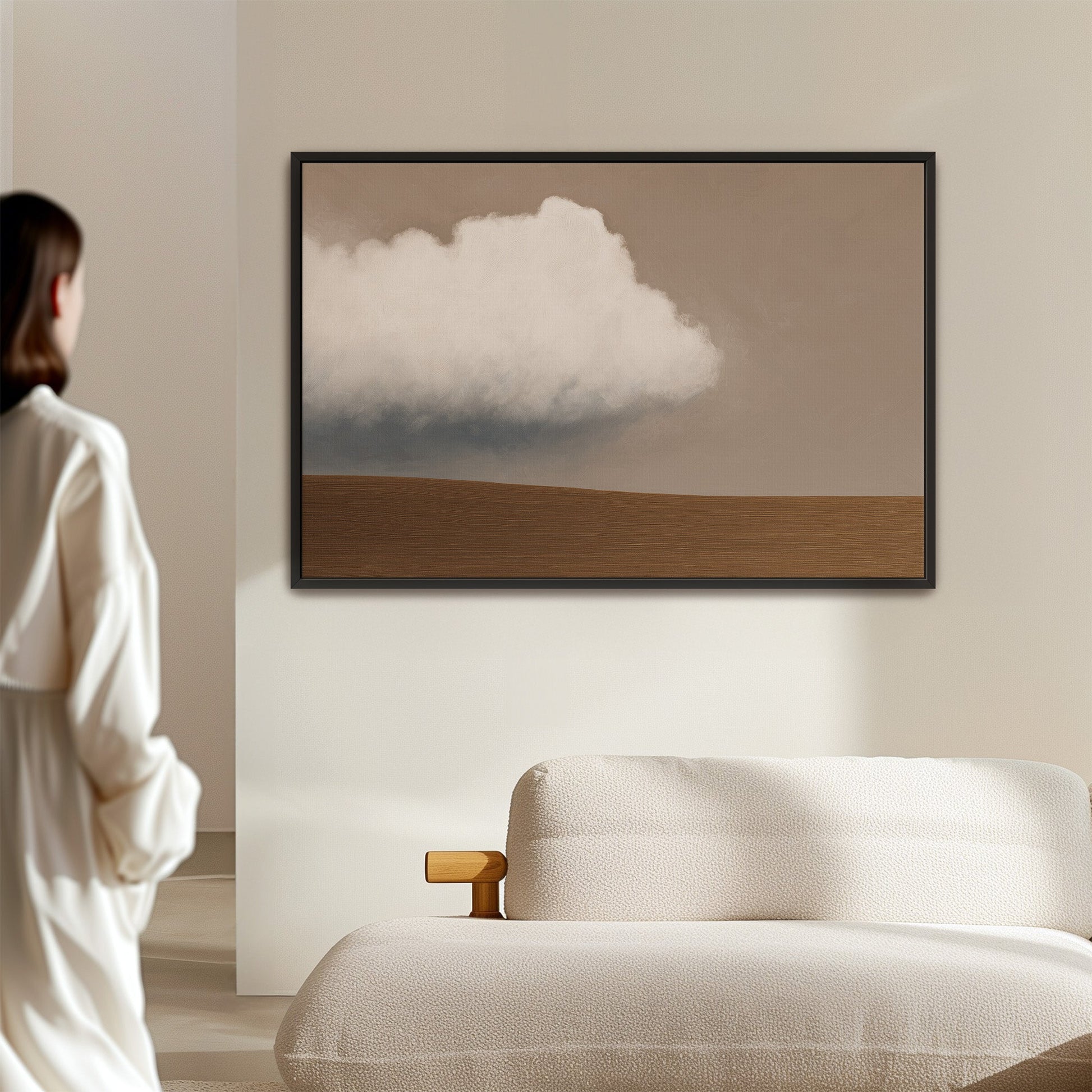Aerie Canvas Print minimalist landscape with single cloud and muted earth tones in black frame above sofa
