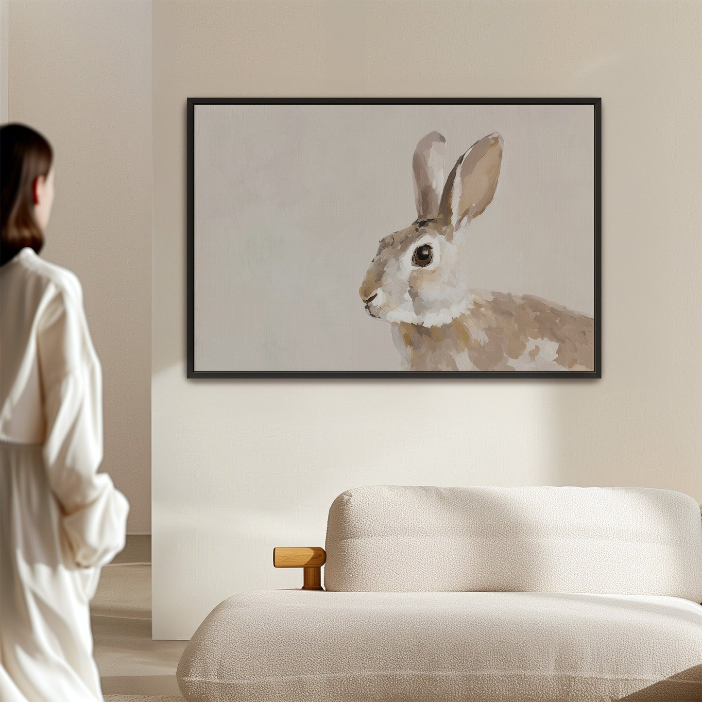 Minimalist Clover Canvas Print featuring a serene rabbit artwork in neutral tones hanging above a modern sofa