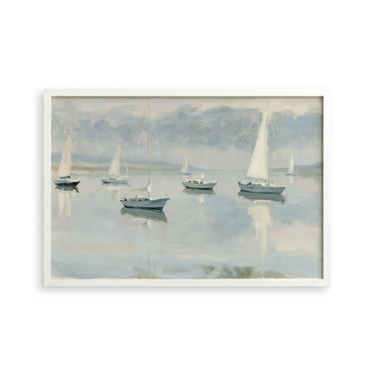 a serene scene of sailboats gently floating on a calm body of water, with a cloudy sky in the background.