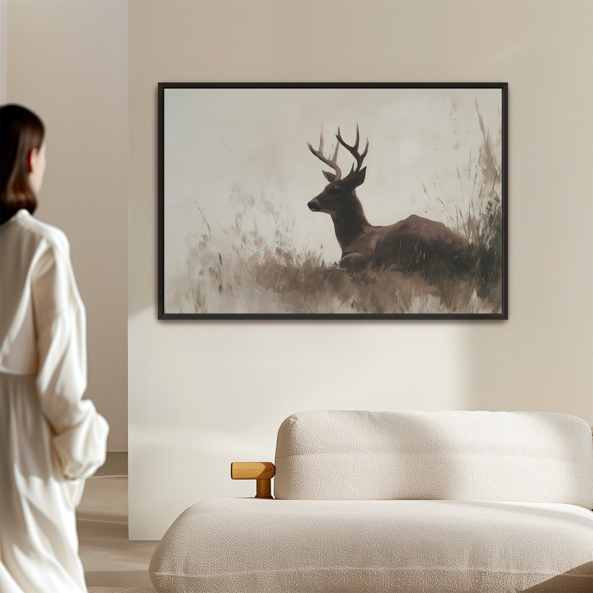 Haven Canvas Print of a resting deer in soft grasses with neutral tones and black frame.