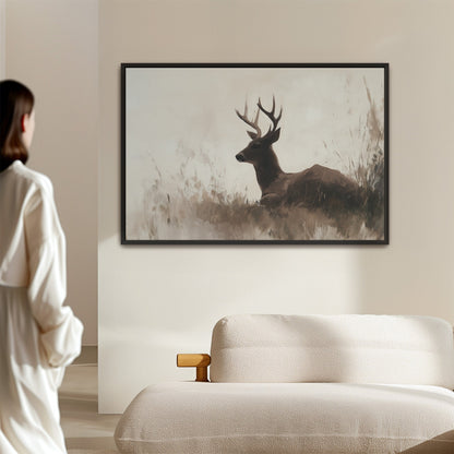 Haven Canvas Print of a resting deer in soft grasses with neutral tones and black frame.