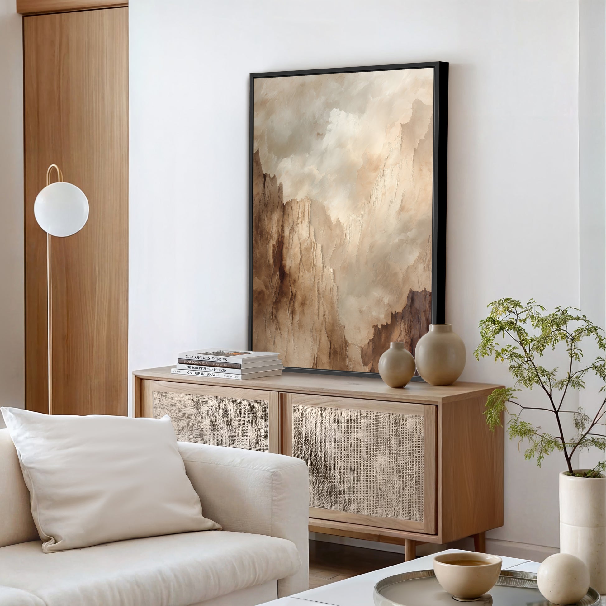 a modern living room with a large abstract painting on the wall, a white sofa, a wooden cabinet, and a potted plant.