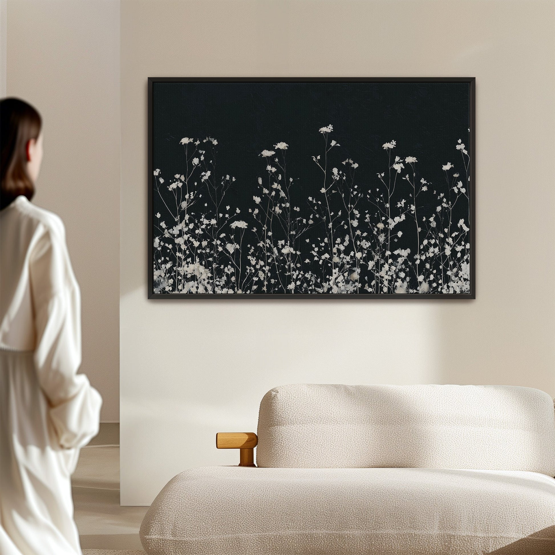 Noiré Canvas Wall Art with delicate white florals on deep charcoal background in modern living room