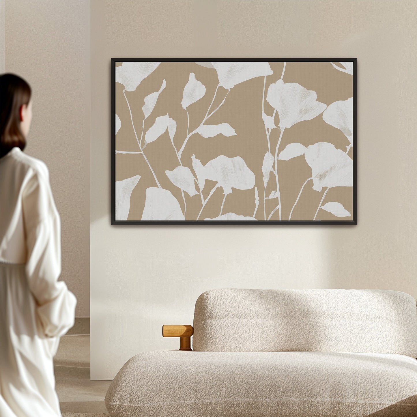 Driftleaf canvas print with white floral silhouettes on beige background in black frame, minimalist wall art.