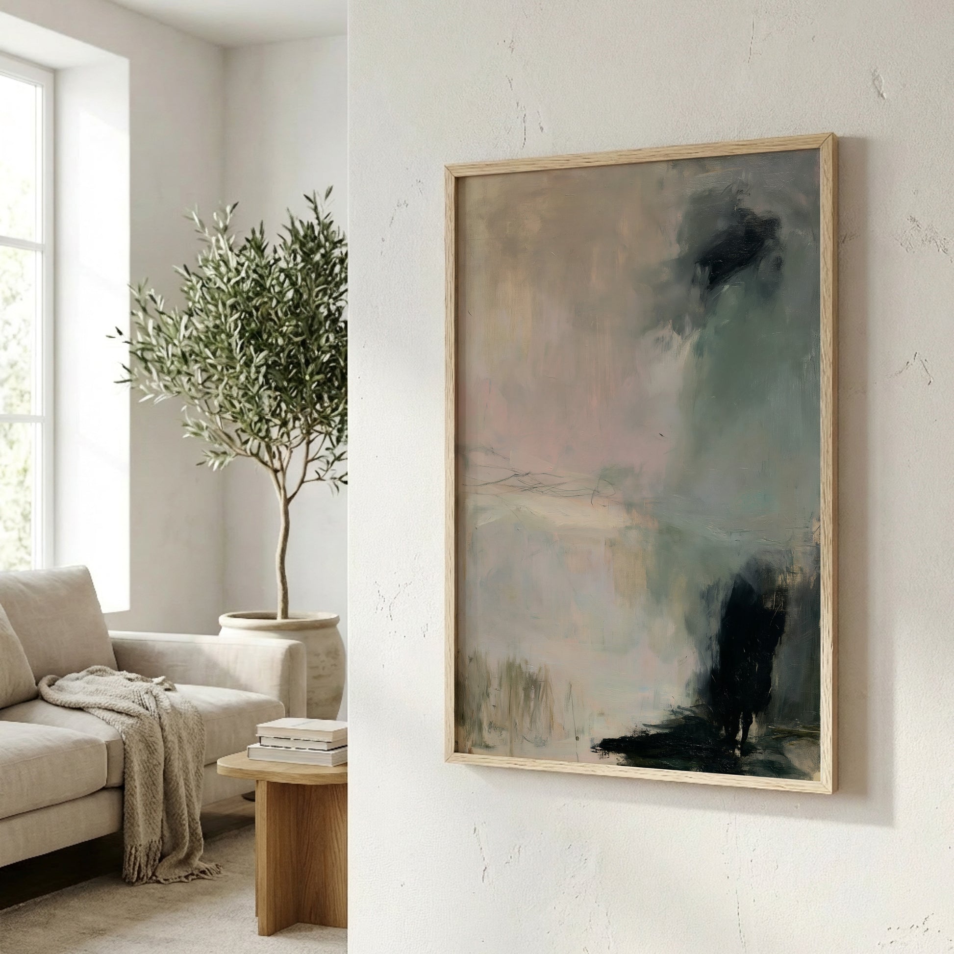 a living room with a large abstract painting hanging on the wall, a sofa, a potted plant, and a wooden side table with books on it.