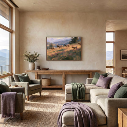 a spacious living room with large windows overlooking a scenic mountain landscape. The room is furnished with a sofa, armchairs, and a wooden console table, creating a cozy and inviting atmosphere. A large painting of a group of deer is displayed on the wall, adding a touch of nature and artistry to the room.