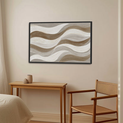 Abstract Flux canvas print with cream, taupe, and clay wavy brushstrokes in black frame above wooden desk and chair in neutral room