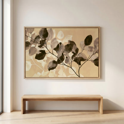 a large, framed painting of leaves hanging on a wall above a wooden bench.