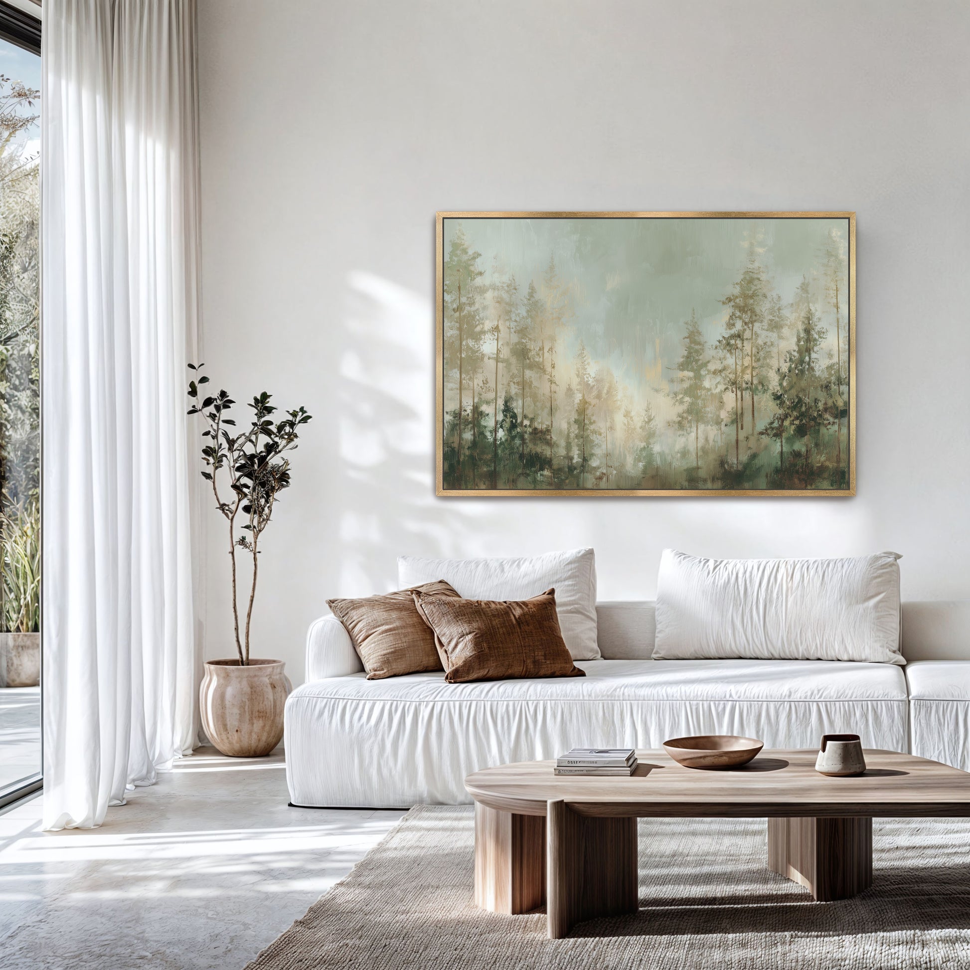 a serene living room with a large painting of a forest scene hanging on the wall. The room is decorated with white furniture, including a sofa and a coffee table, and features a large window that allows natural light to fill the space.