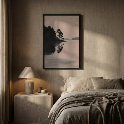 a serene bedroom scene with a large framed landscape photograph hanging on the wall above a bed with a gray blanket.