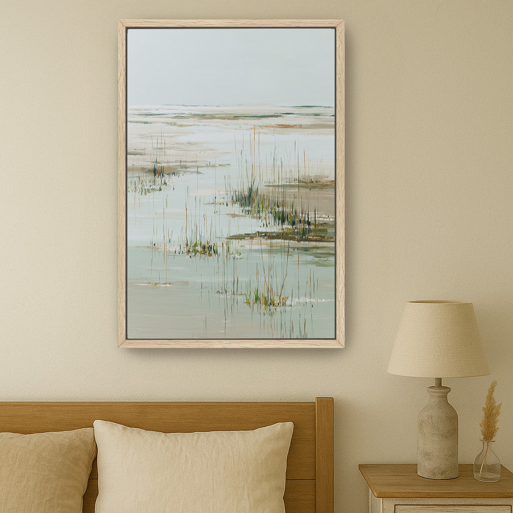 a serene bedroom scene with a large framed painting of a tranquil body of water hanging on the wall above a bed with a wooden headboard.