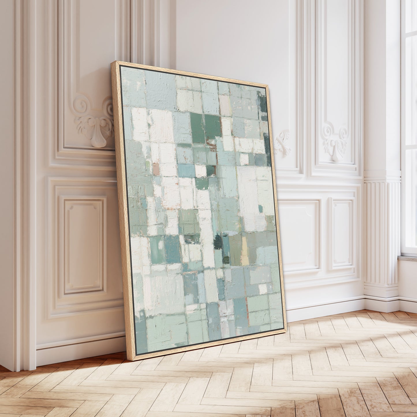 Geometric abstract painting leaning against ornate white wall with parquet flooring.