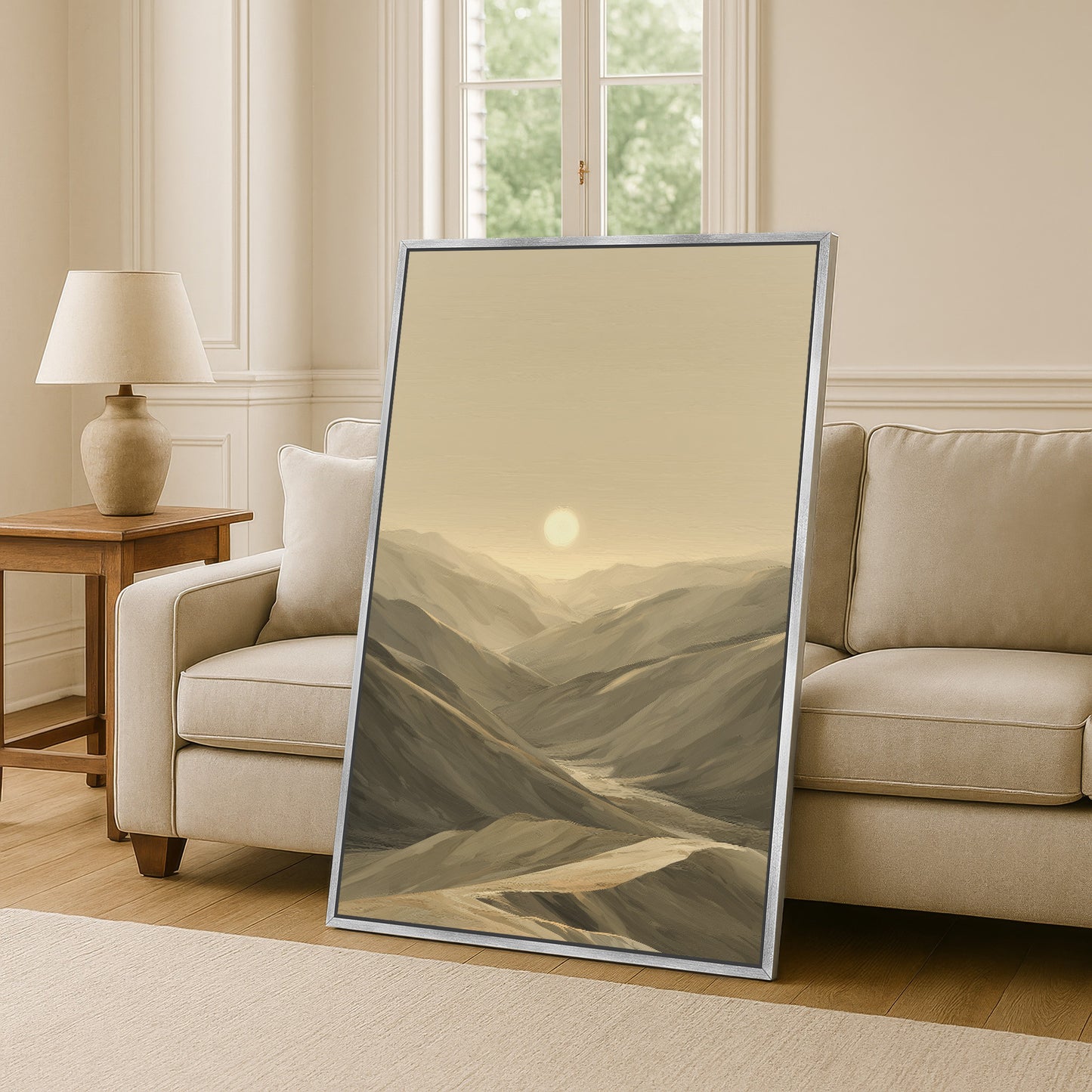 Desert mountains in a contemporary living room with a silver floater frame.