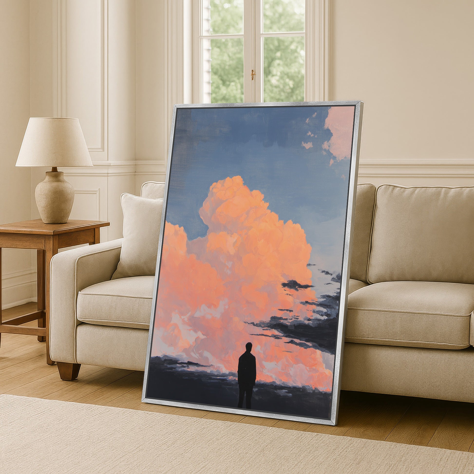 a large framed painting depicting a person standing in front of a vibrant sky with clouds, creating a serene and contemplative atmosphere.