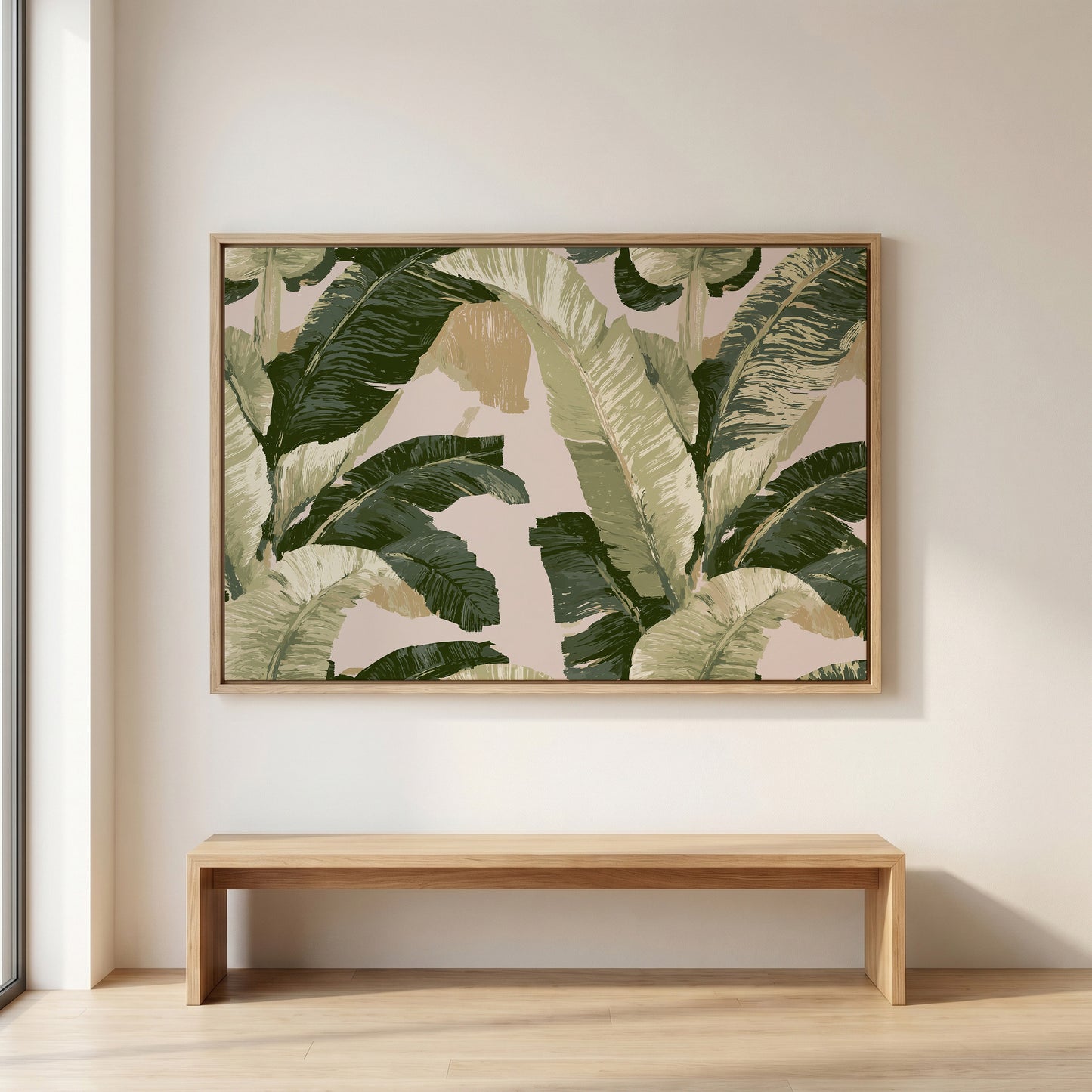 a large framed picture of a tropical plant hanging on a wall above a wooden bench.