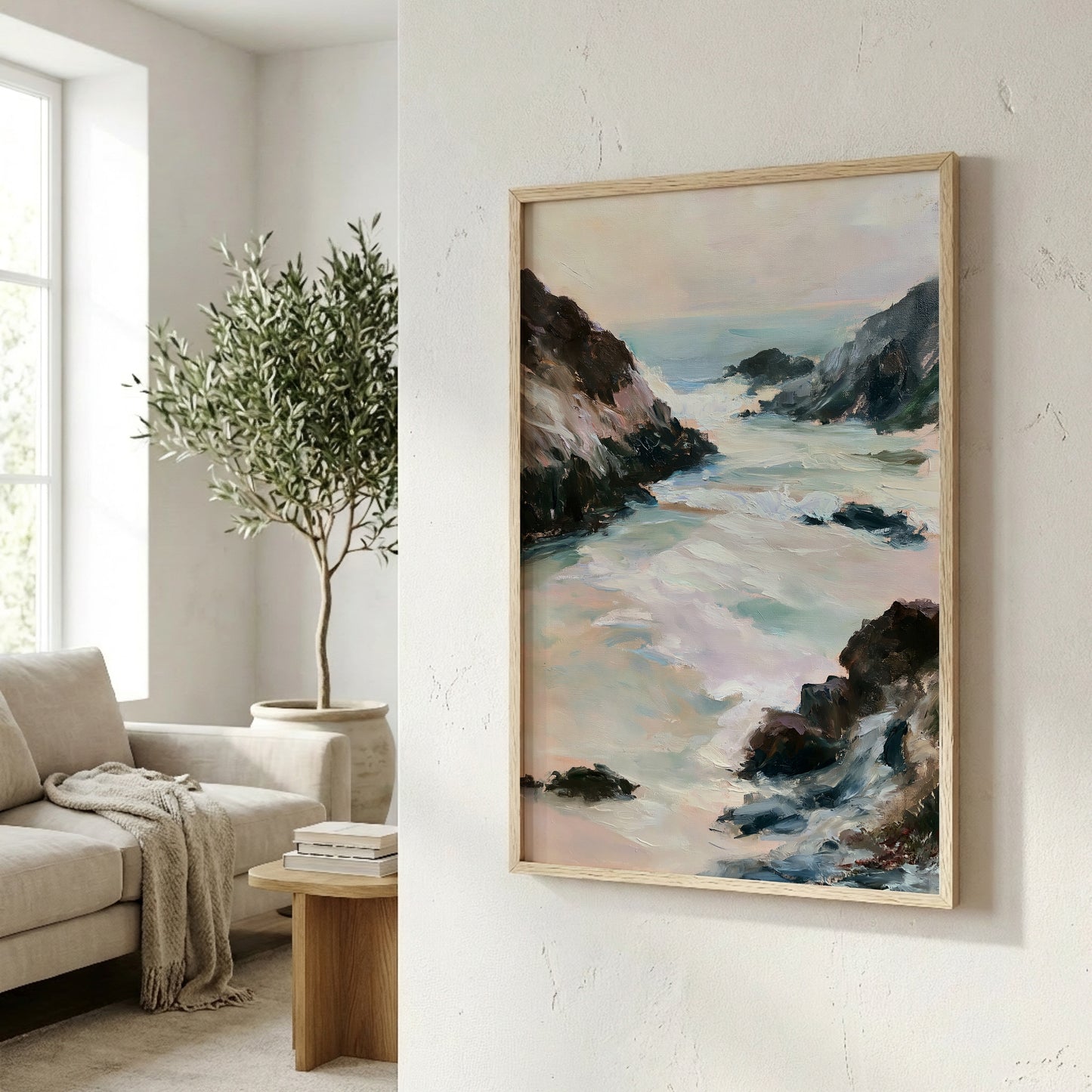 a living room with a large painting of a serene landscape hanging on the wall, depicting a rocky coastline with crashing waves. The painting is framed in a wooden frame and is the focal point of the room. In the background, there is a comfortable couch and a potted plant, creating a cozy and inviting atmosphere.