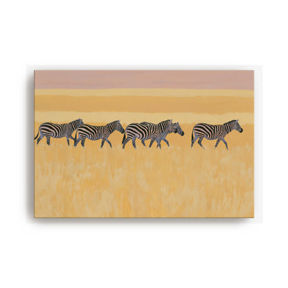 A group of zebras walking across a grassy plain.