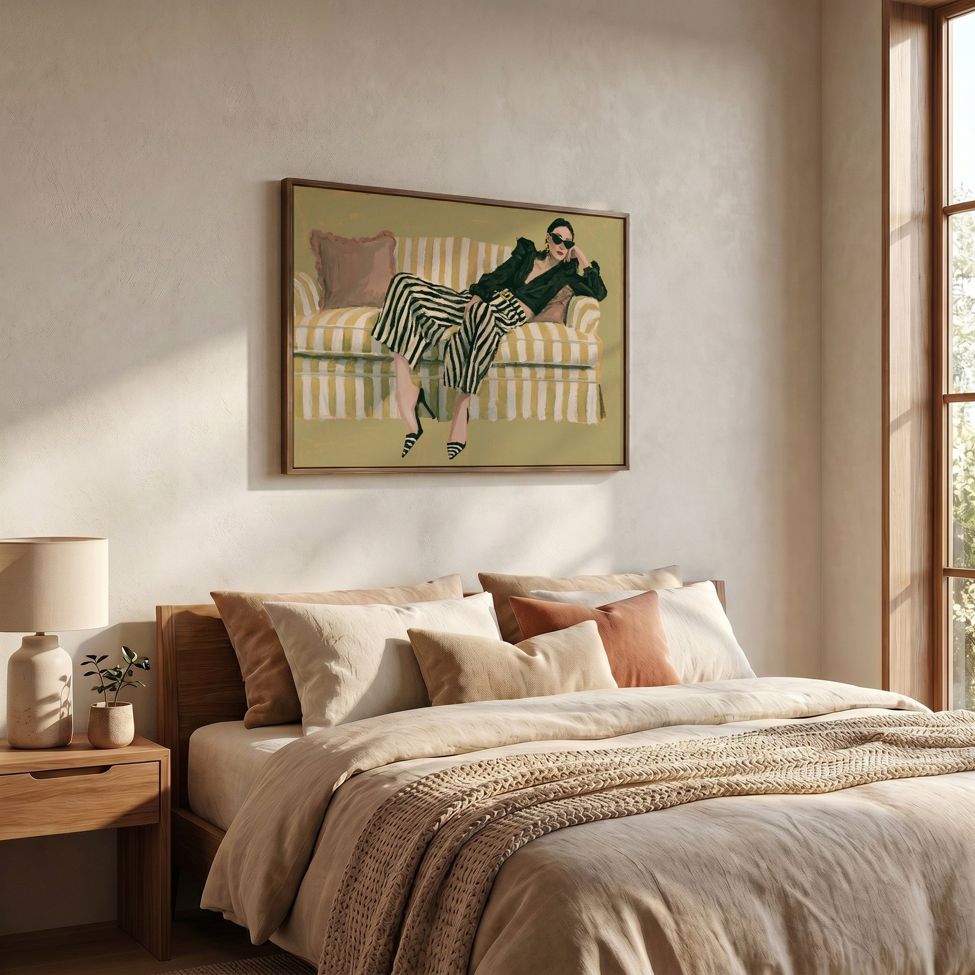 a bedroom with a large bed, a framed painting of a woman sitting on a striped couch, and a lamp on a side table.