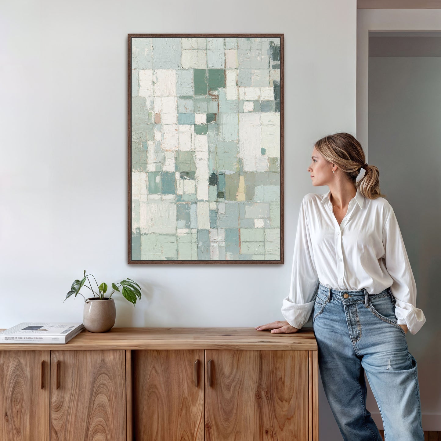 Abstract geometric canvas with warm espresso frame in modern home interior.