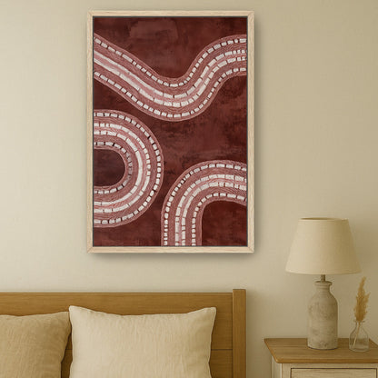 Minimal abstract framed canvas print hanging above neutral bed.