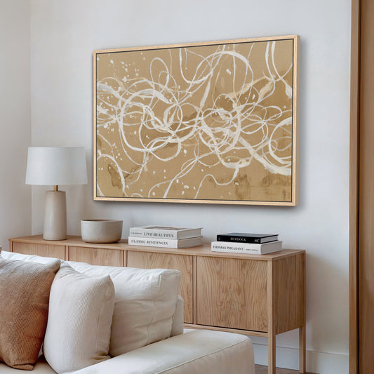 Abstract linework canvas art with ivory strokes in natural frame styled in modern living room