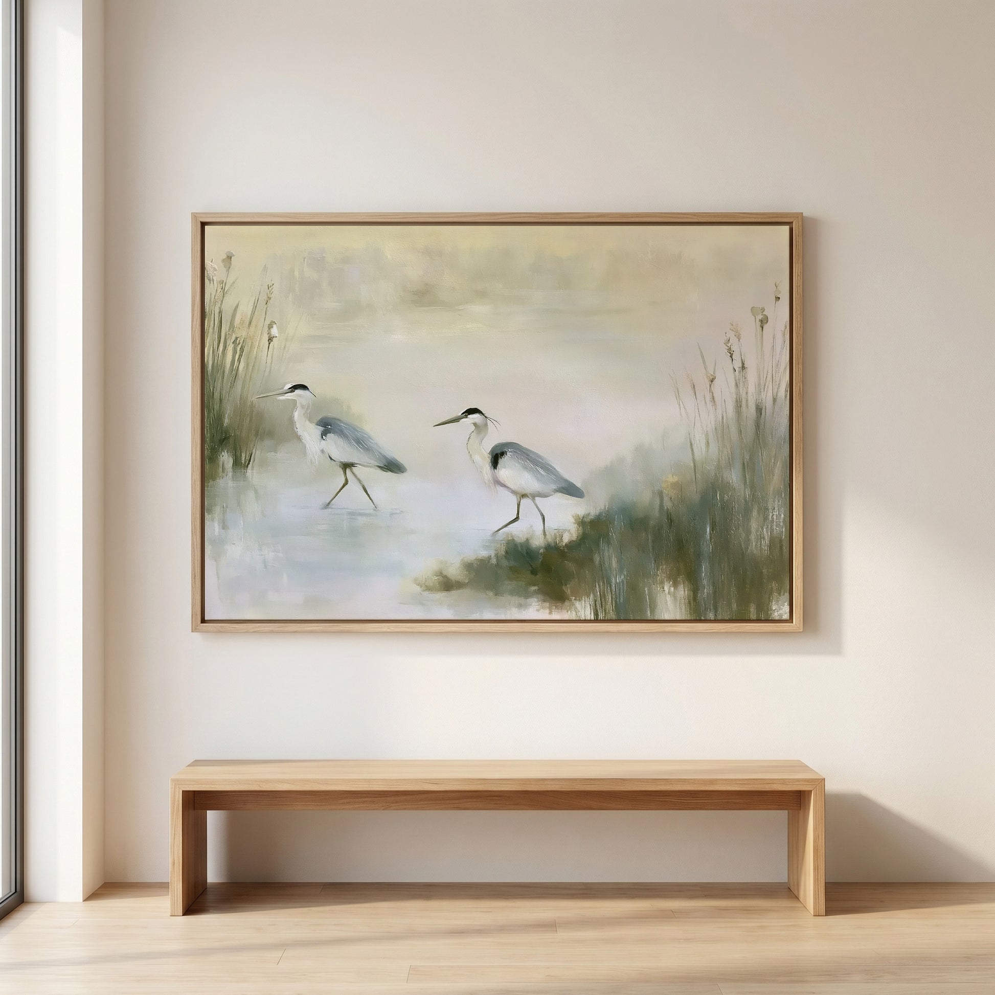 a large painting of two birds walking in a grassy field, hanging on a wall above a wooden bench.