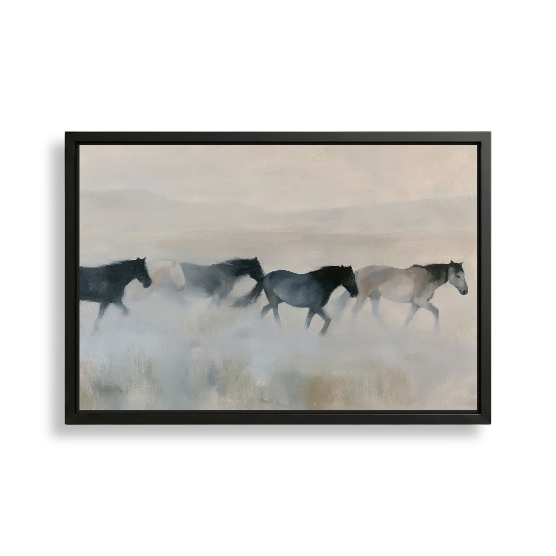 A group of horses running across a field, with a hazy, misty background.