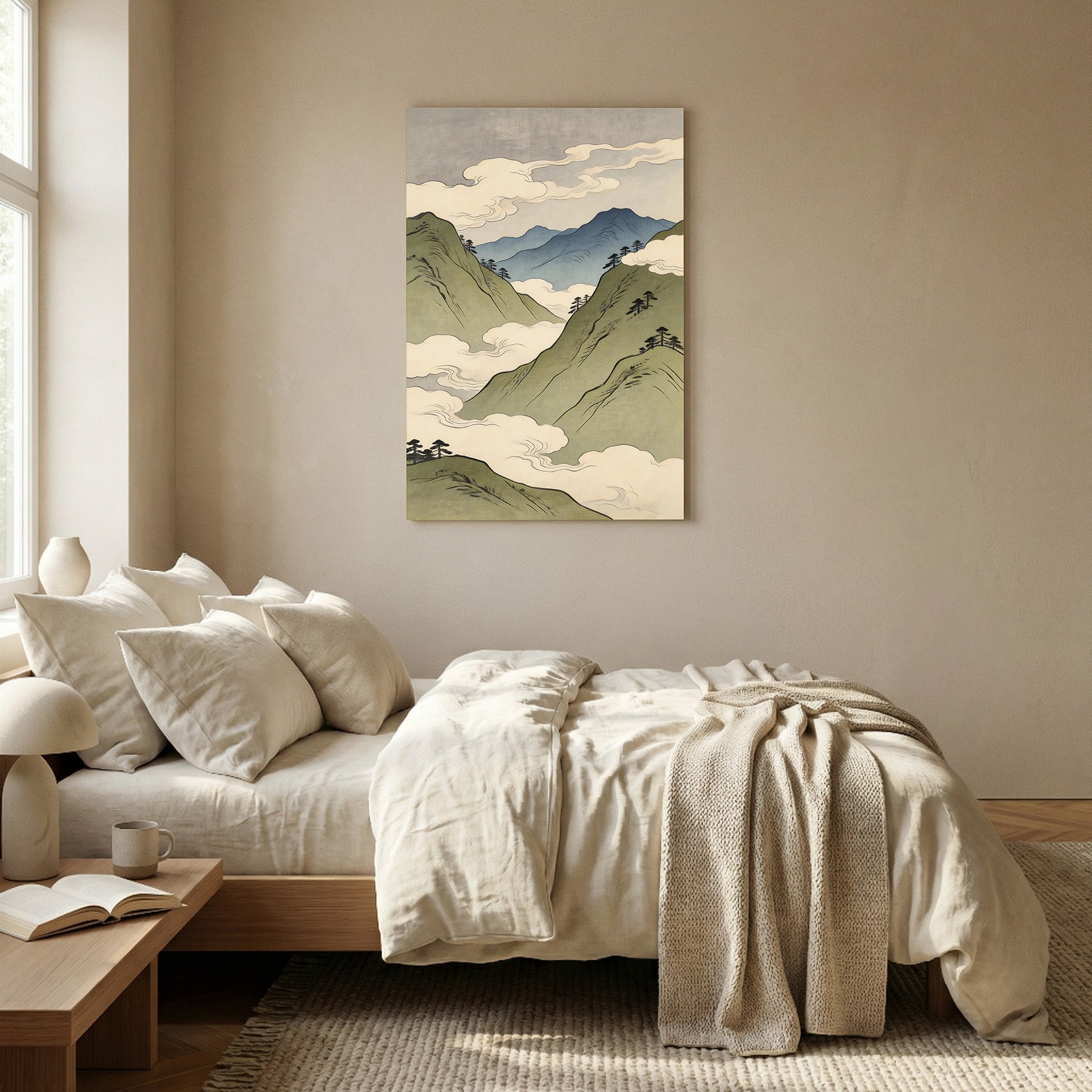 Asian inspired mountain landscape art print with green peaks and clouds in natural wood frame above neutral bedroom