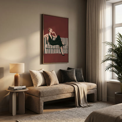 a cozy living room with a large window, a sofa with pillows, and a framed illustration of a woman sitting on a couch.