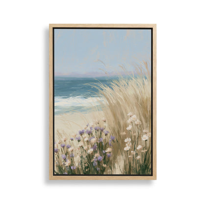 The image is a framed painting depicting a serene coastal scene with tall grasses swaying in the foreground and the ocean in the background.