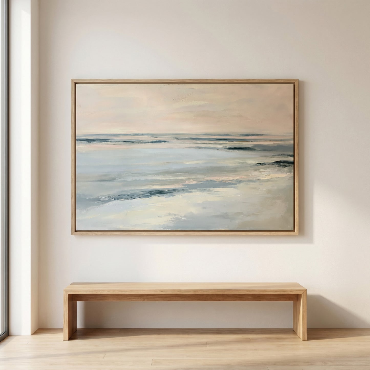 a large painting of a serene ocean scene hanging on a wall above a wooden bench.