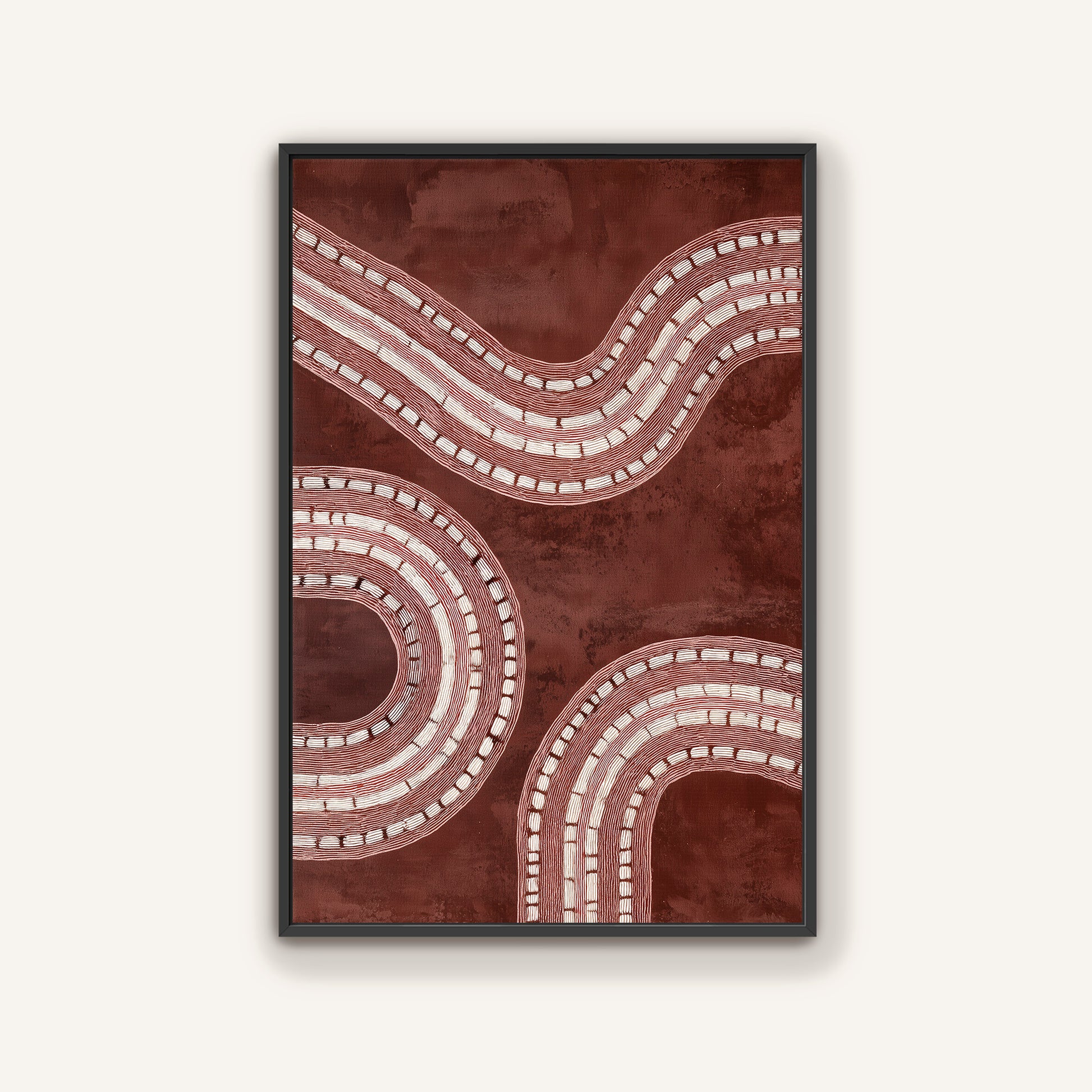 Black framed abstract art with wavy lines on a brown background.