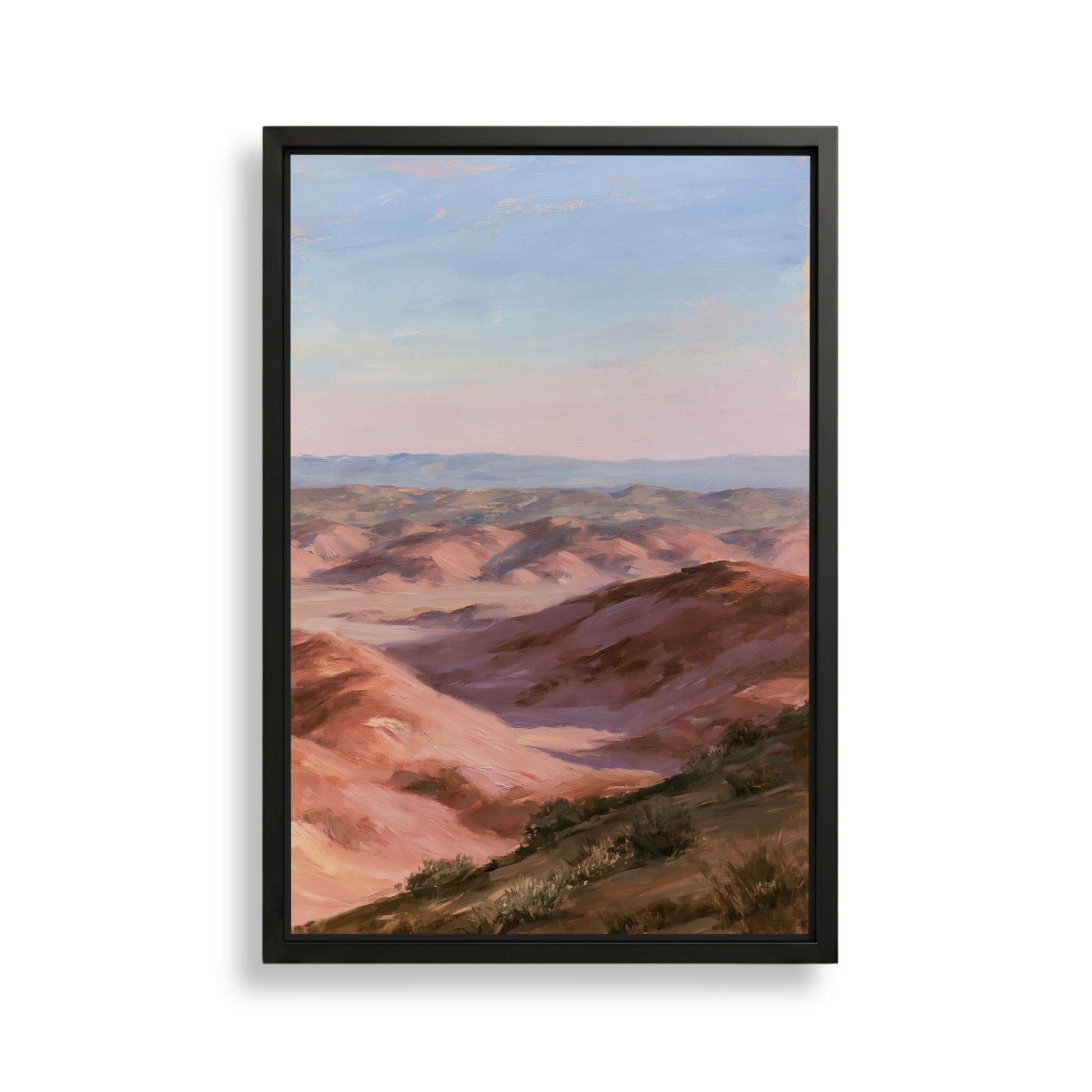 The image is a framed painting depicting a scenic landscape with rolling hills and a clear blue sky.