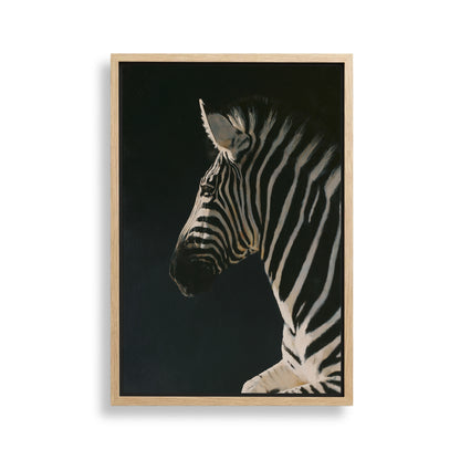 A close-up portrait of a zebra against a dark background, with its distinctive black and white stripes prominently featured.