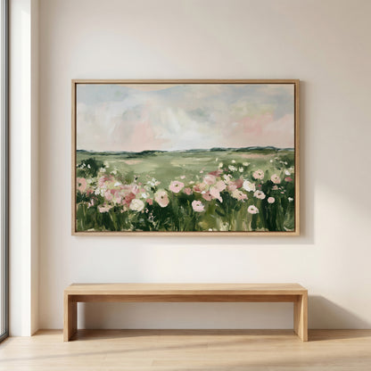a large painting of a field with pink flowers hanging on a wall above a wooden bench.
