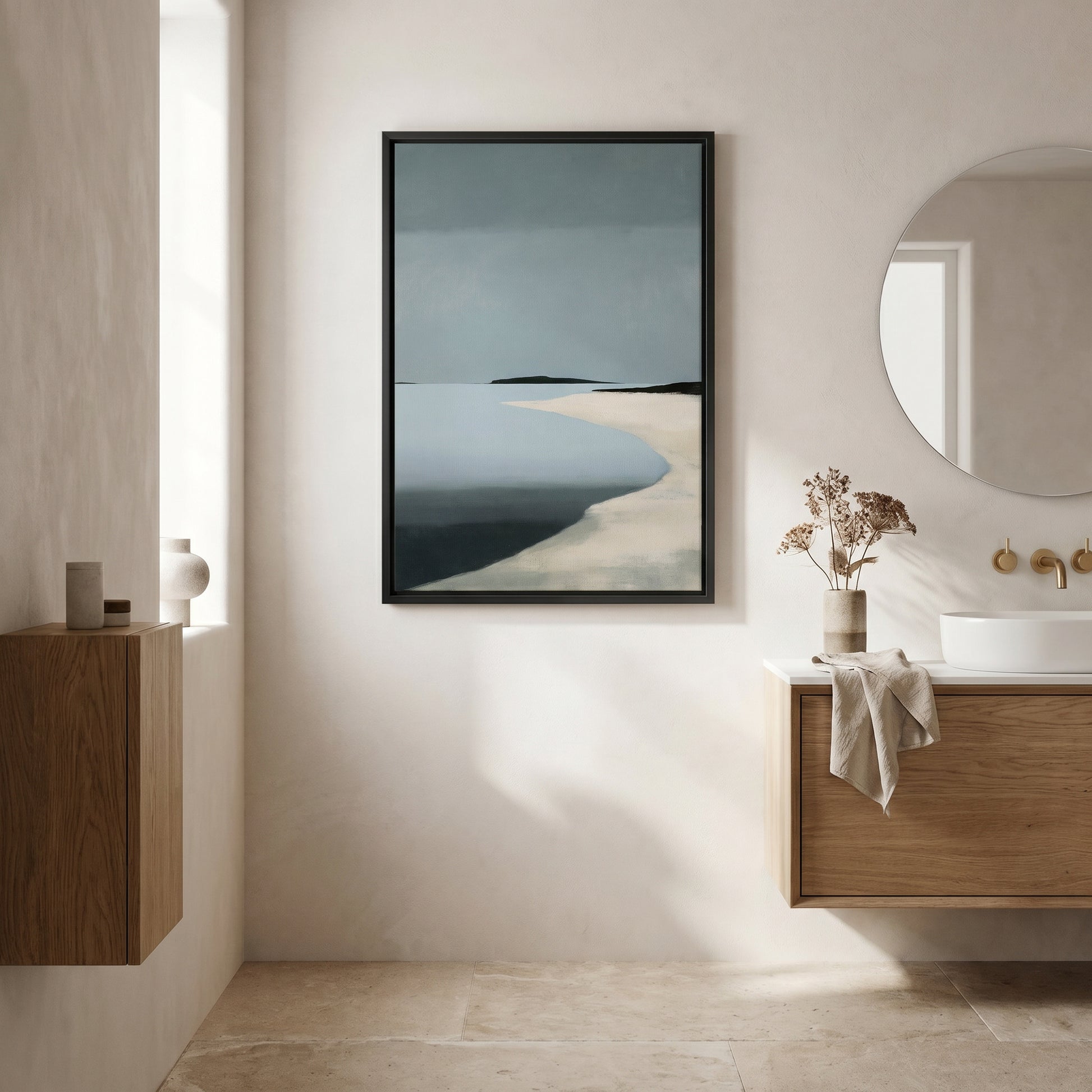 a serene bathroom scene with a large framed painting of a beach landscape hanging on the wall above a wooden vanity with a white sink.