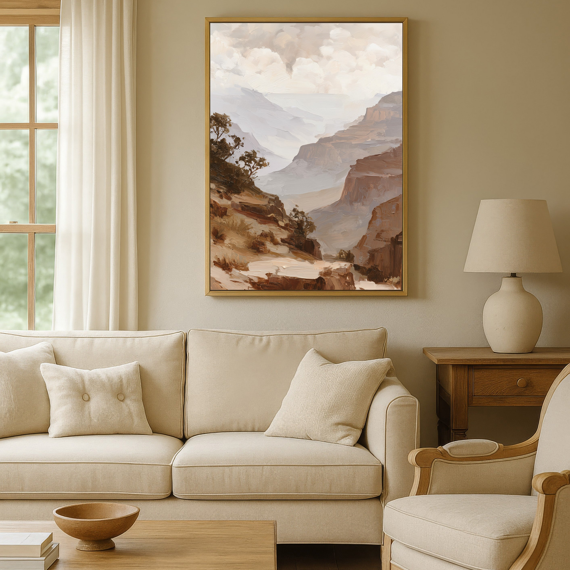 a cozy living room with a large painting of a mountainous landscape hanging on the wall above a beige sofa and armchair. The room has a warm, neutral color scheme with a wooden coffee table and a lamp on a side table.