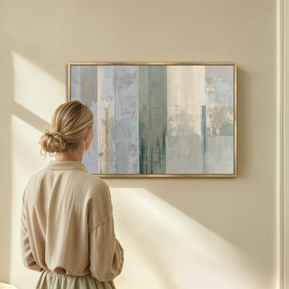 A woman stands in front of a large abstract painting, gazing at it with interest.