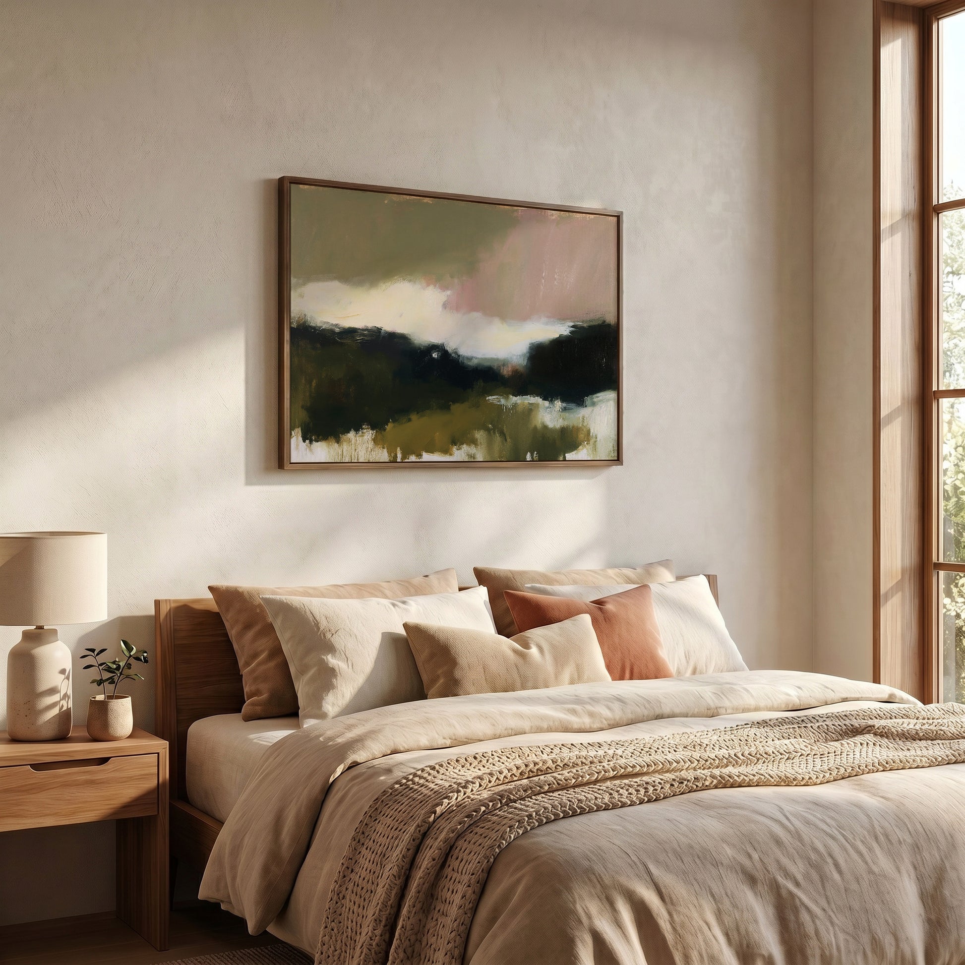 a serene and cozy bedroom with a large bed adorned with beige bedding and a wooden headboard. Above the bed, a framed landscape painting adds an artistic touch to the room. The room is well-lit, with natural light streaming in from a window on the right side, creating a warm and inviting atmosphere.
