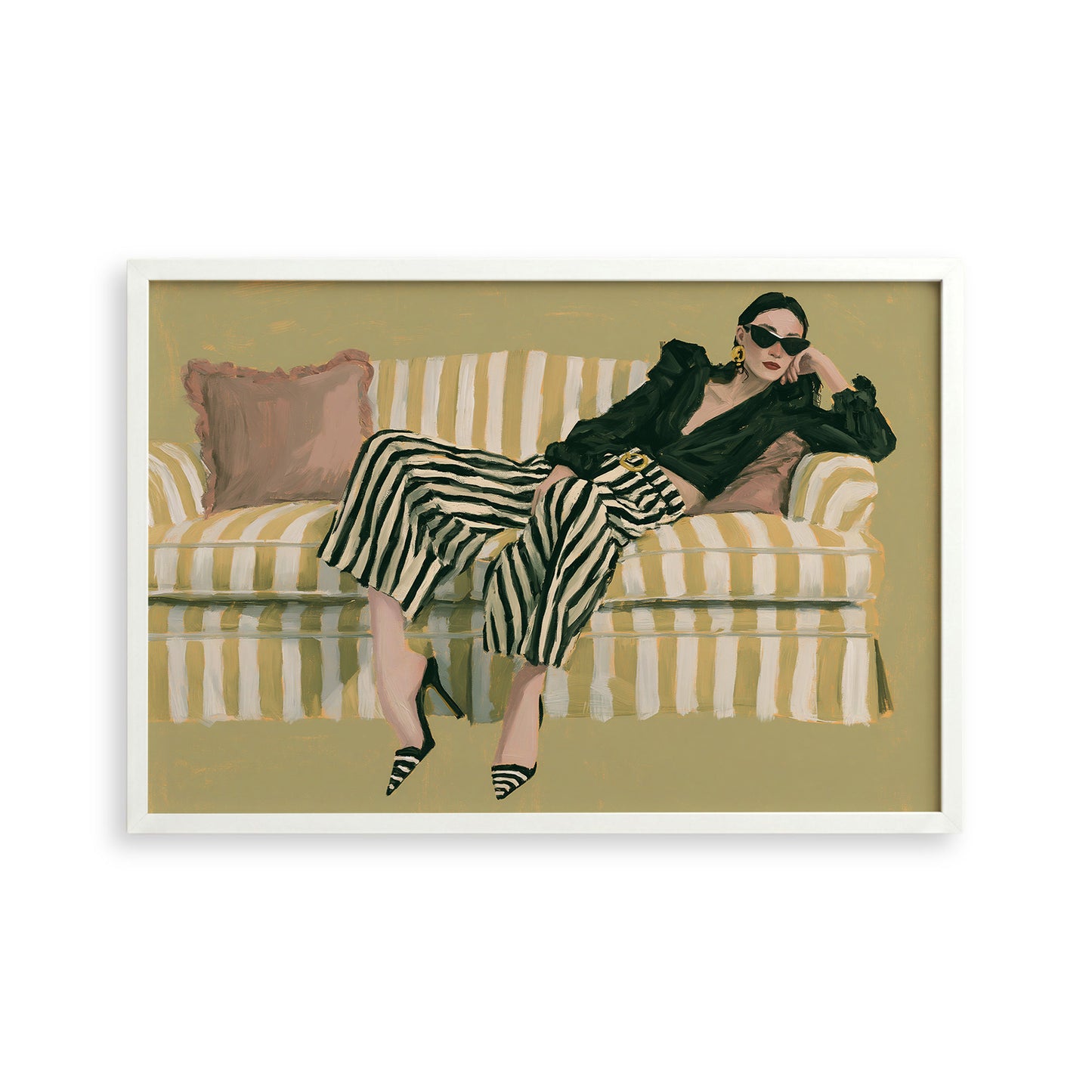 A woman is sitting on a striped couch, wearing a black jacket and striped pants, with her legs crossed and her head resting on her hand.
