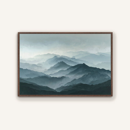 a breathtaking view of a mountainous landscape, with a hazy, misty atmosphere that creates a sense of depth and distance. The mountains appear to be covered in a light gray color, with darker shades of gray and brown adding texture and contrast to the scene. The image is framed and hung on a wall, showcasing the beauty and serenity of the natural environment.