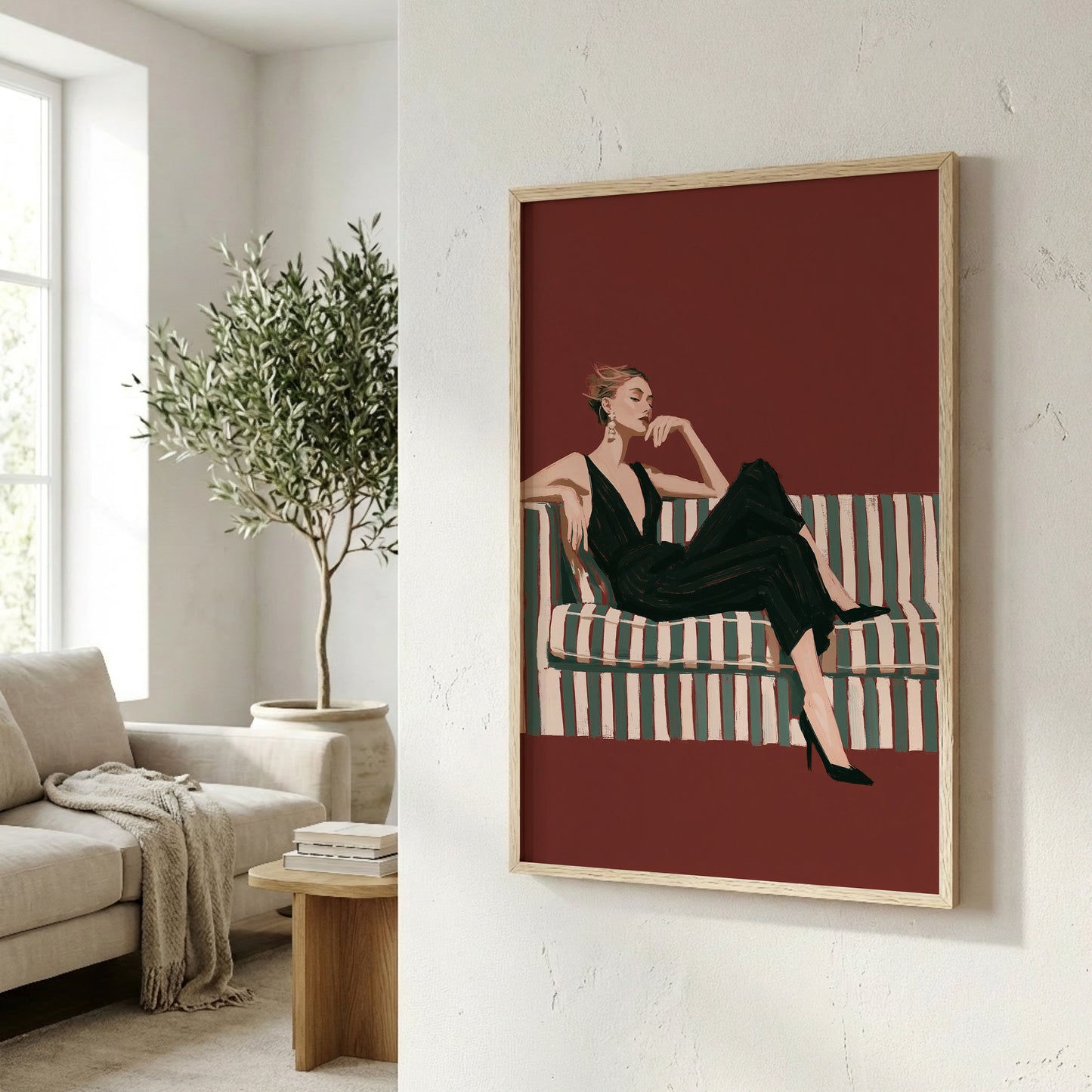 a framed illustration of a woman sitting on a striped couch, with a potted plant and a wooden side table visible in the background.