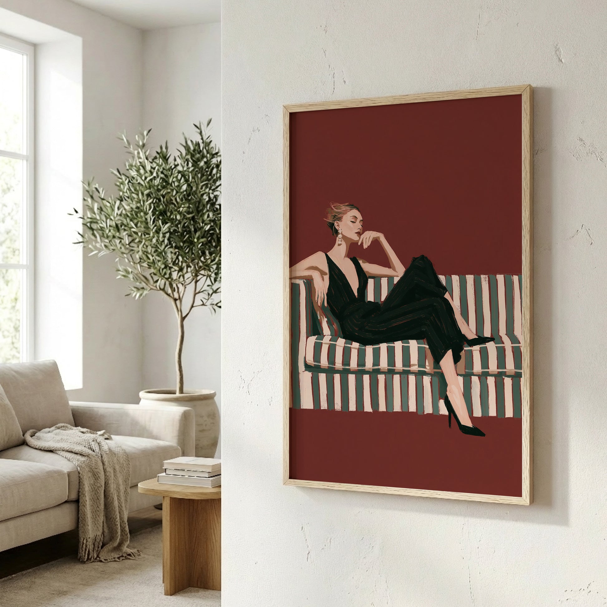 a framed illustration of a woman sitting on a striped couch, with a potted plant and a wooden side table visible in the background.