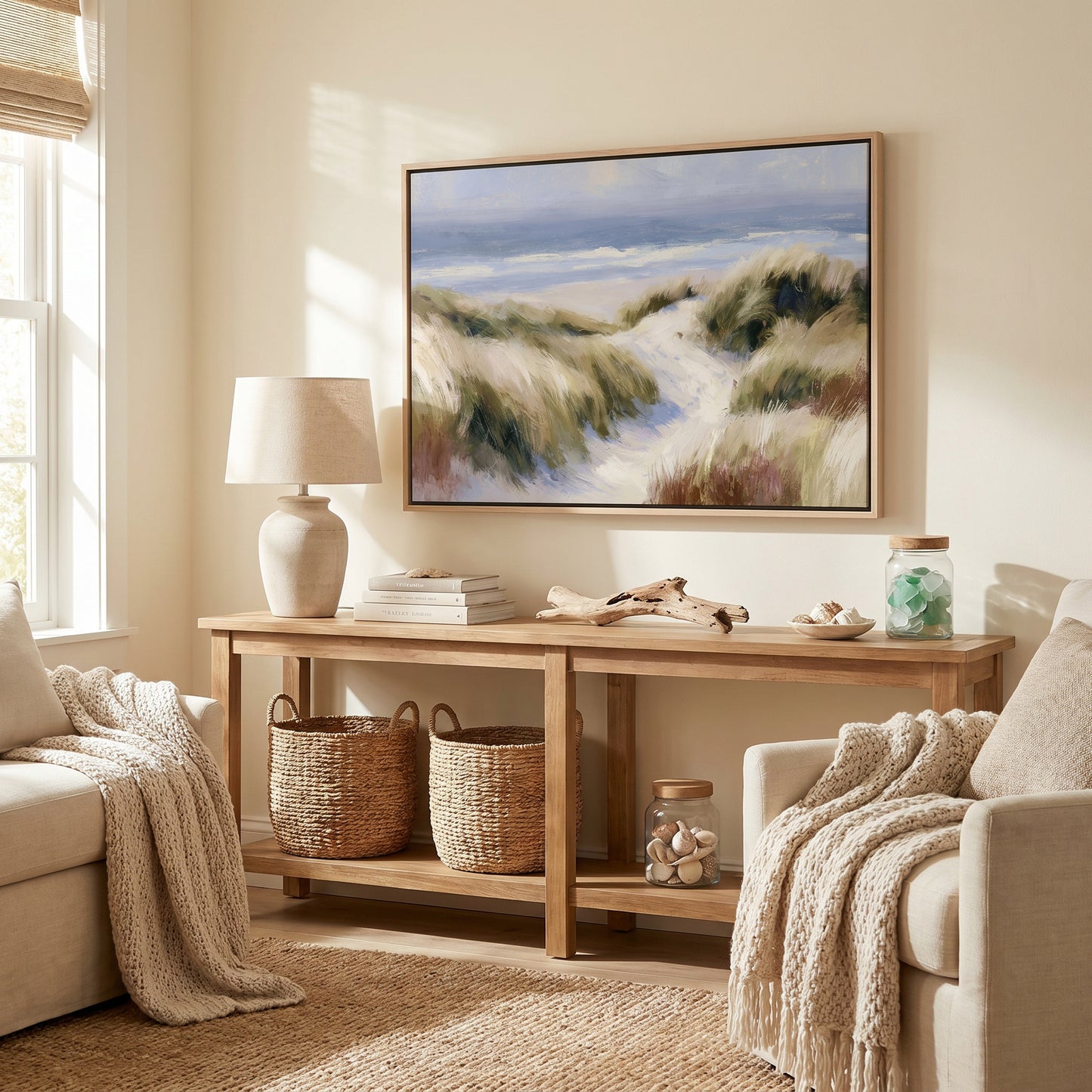 a cozy living room with a large painting of a beach scene hanging on the wall. The room is furnished with a sofa, a wooden console table, and a rug. The painting adds a touch of nature and serenity to the space, creating a warm and inviting atmosphere.