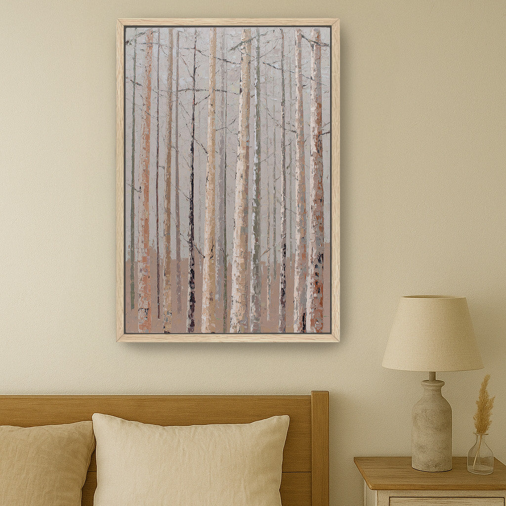a serene bedroom scene with a wooden headboard, a framed painting of a forest of bare trees, and a lamp on a nightstand.