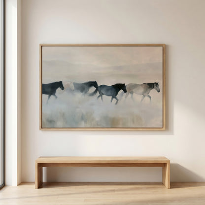 a large painting of horses running in a field, hanging on a wall above a wooden bench.