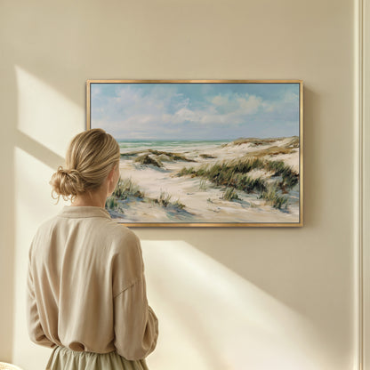 Woman admiring coastal dunes canvas wall art on beige wall
