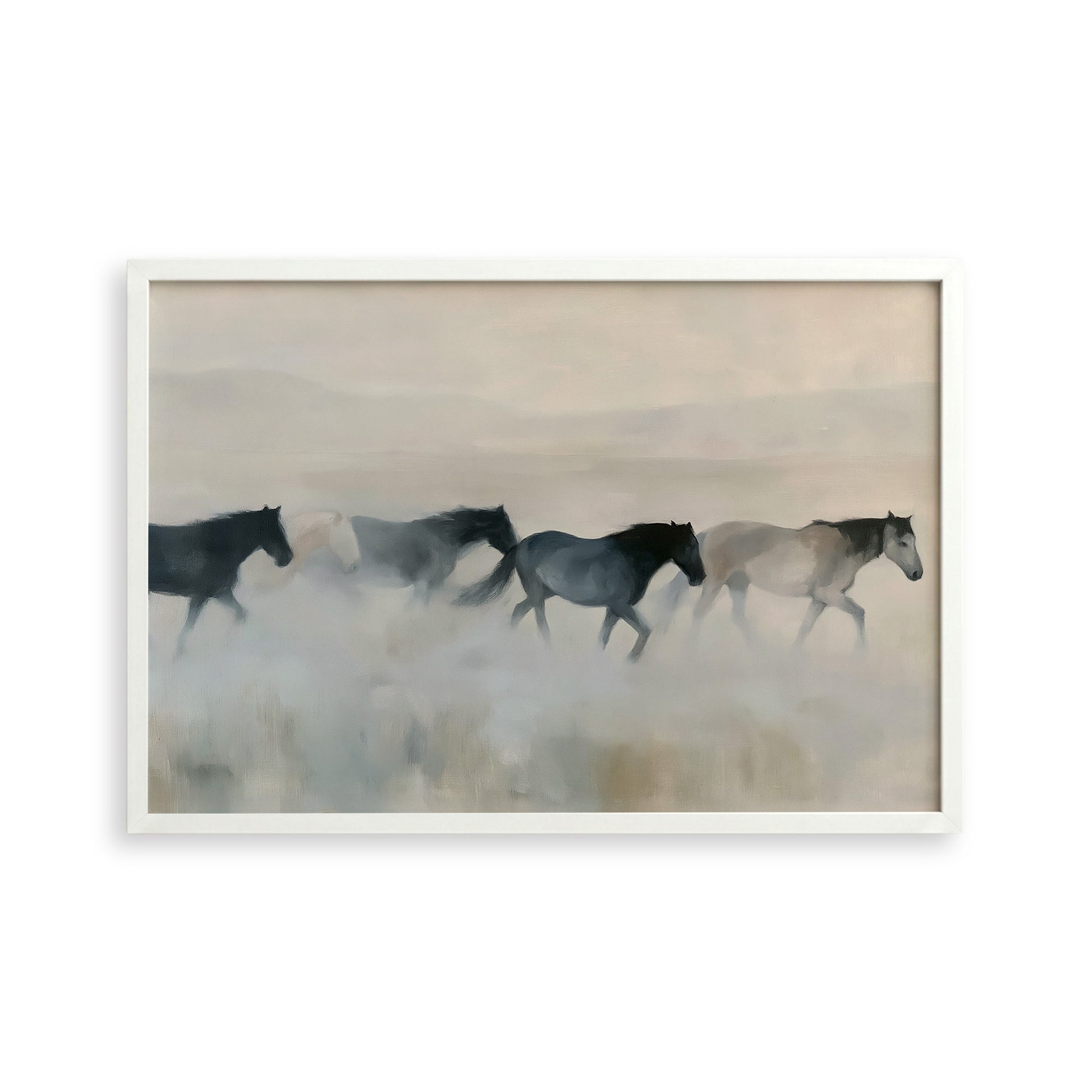 A group of horses running across a field, with a hazy, misty background.
